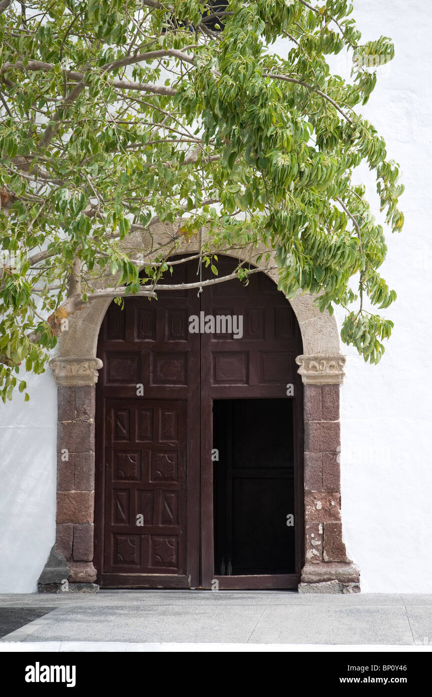 Carved wooden door at the catholic church in Uga Lanzarote Canary Islands Spain Stock Photo