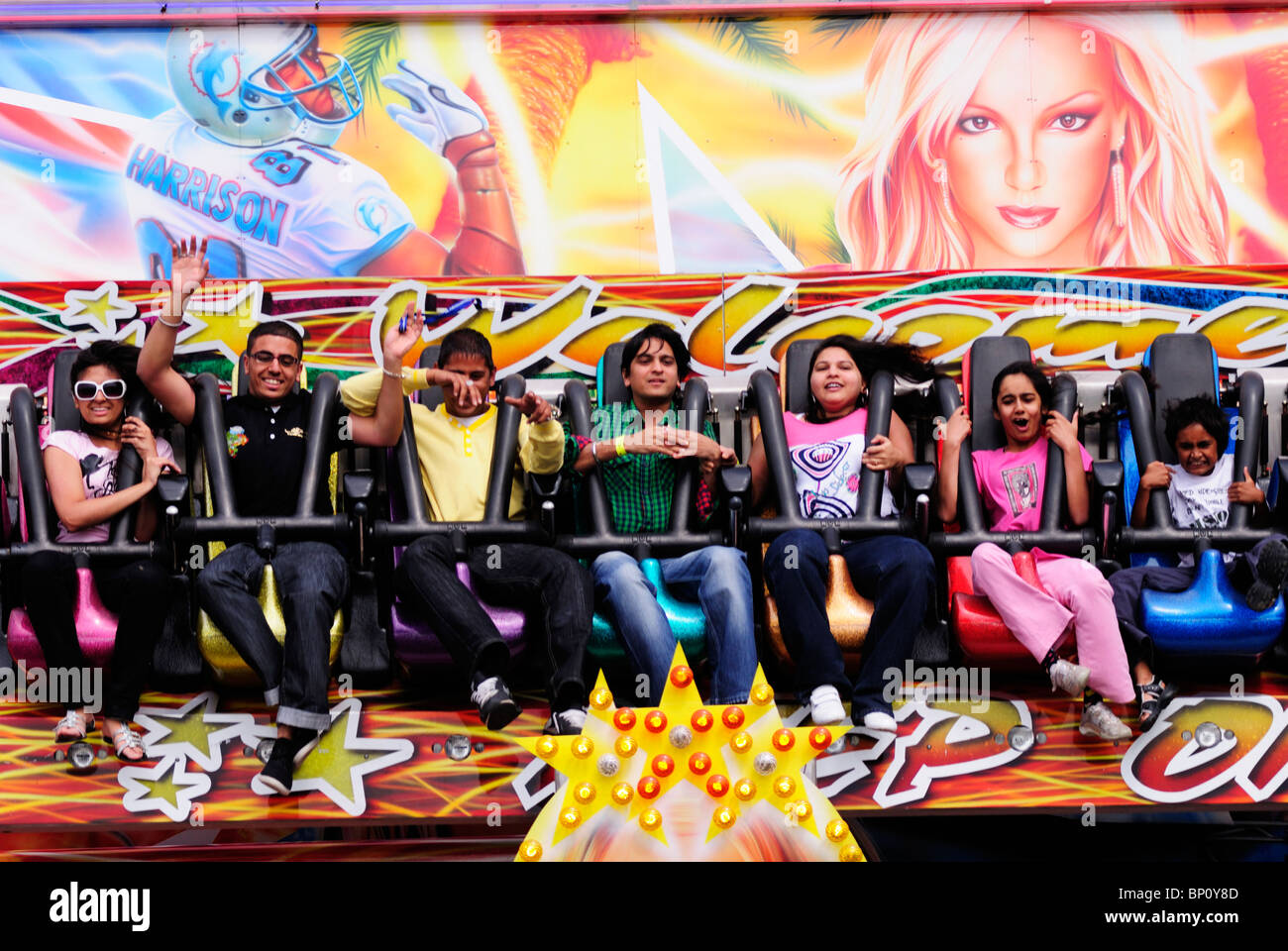 Children on a Funfair ride at the London Mela, Gunnersbury Park, London, England, UK Stock Photo