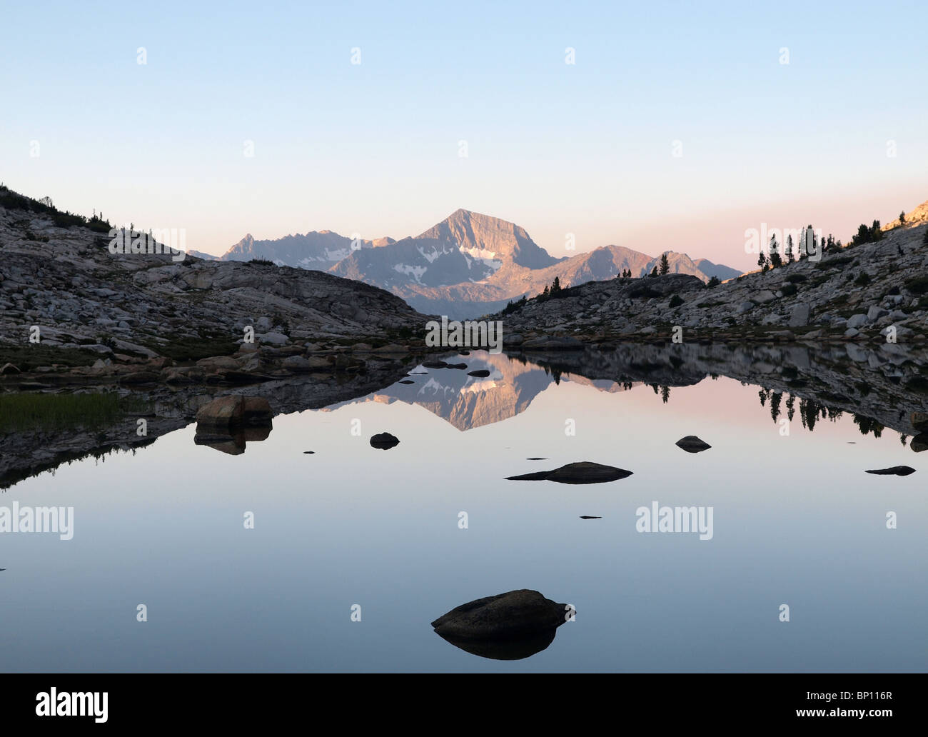 12,195 foot Mt. Henry reflected in a high alpine pond in the John Muir Wilderness of the Sierra National Forest. Stock Photo