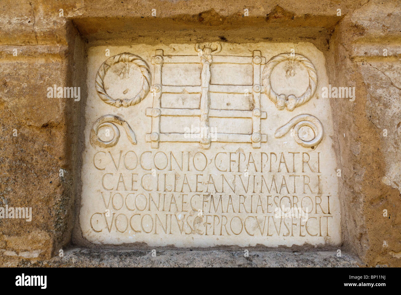 Merida, Badajoz Province, Spain. Marble dedication slab on the first century AD mausoleum of the Roman Voconio family. Stock Photo