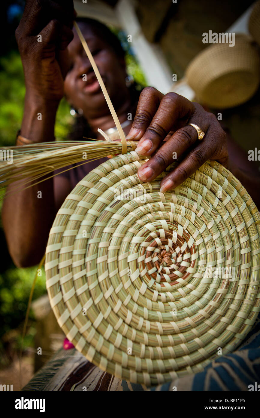 Barbara Manigault, a Gullah sweet grass basket weaver at her stand in