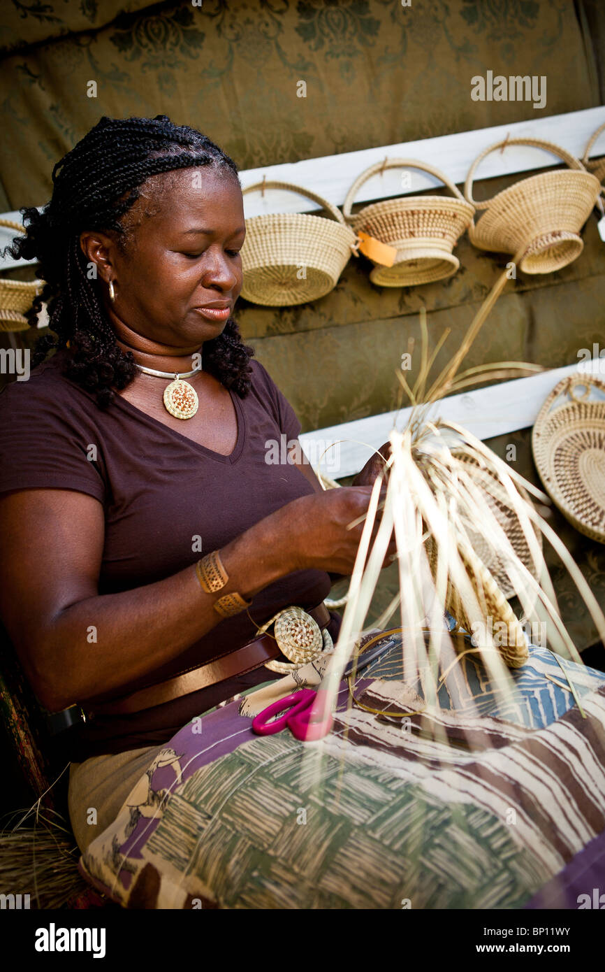 Barbara Manigault, a Gullah sweet grass basket weaver at her stand in