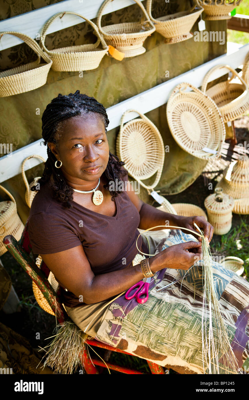 Barbara Manigault, a Gullah sweet grass basket weaver at her stand in