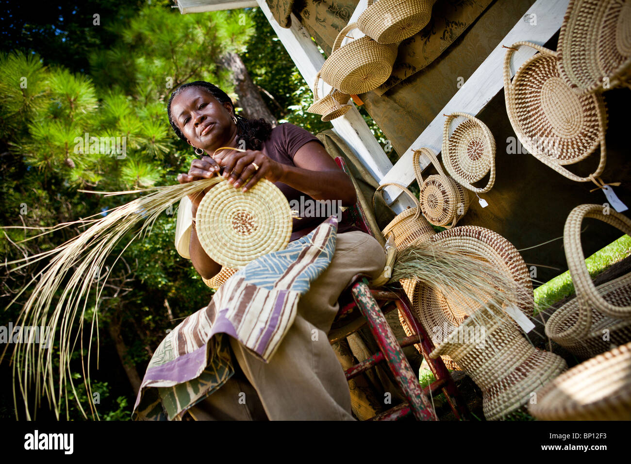 Barbara Manigault, a Gullah sweet grass basket weaver at her stand in