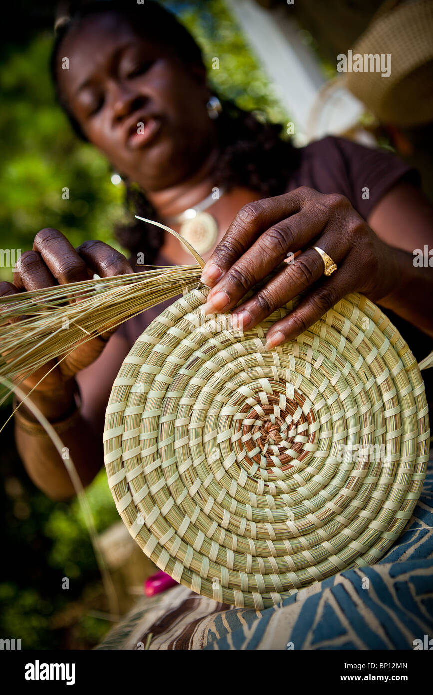 Barbara Manigault, a Gullah sweet grass basket weaver at her stand in
