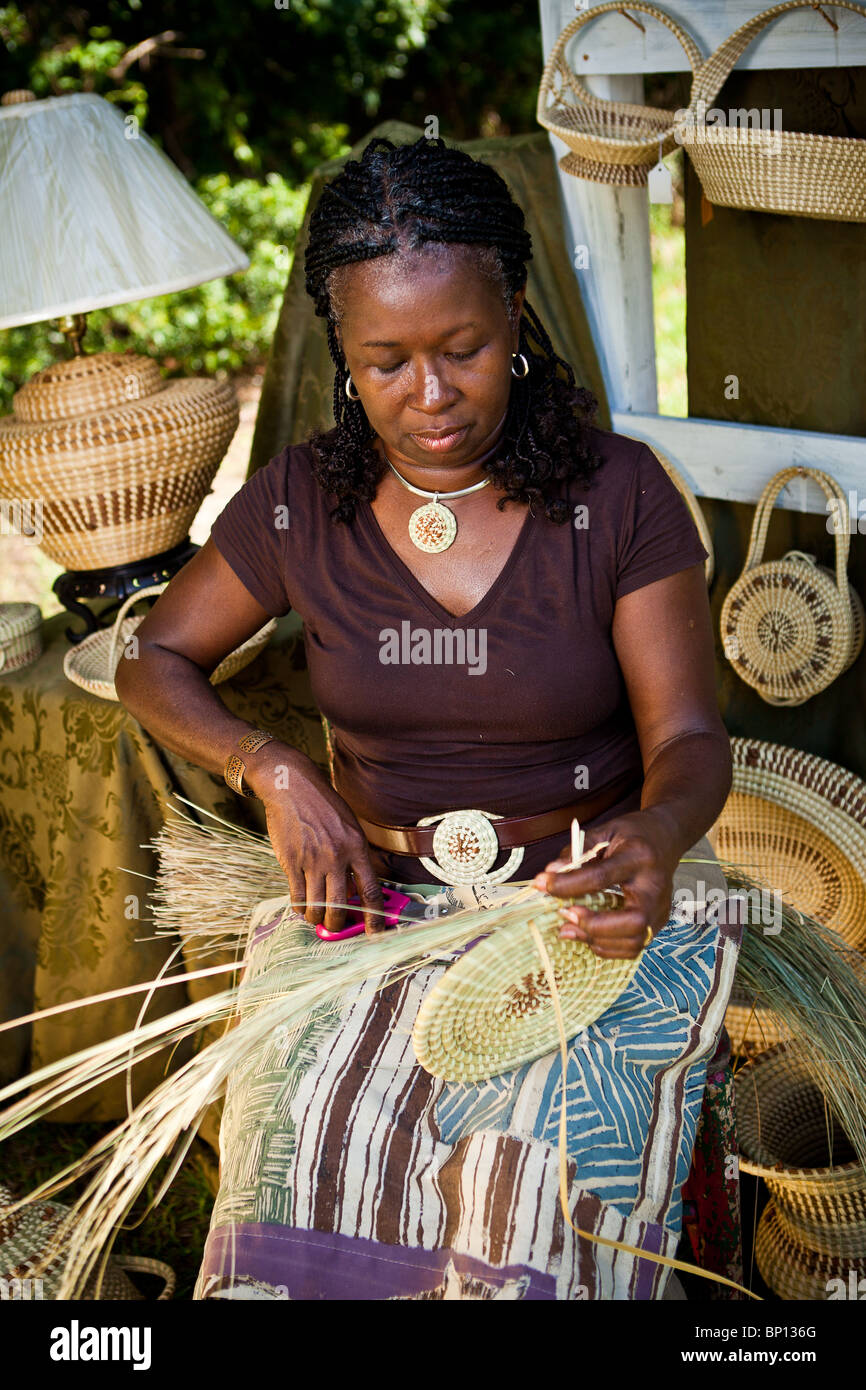 Barbara Manigault, a Gullah sweet grass basket weaver at her stand in
