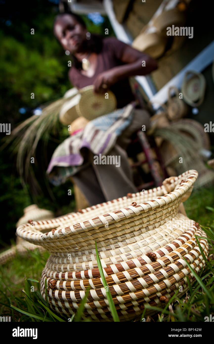 Barbara Manigault, a Gullah sweet grass basket weaver at her stand in