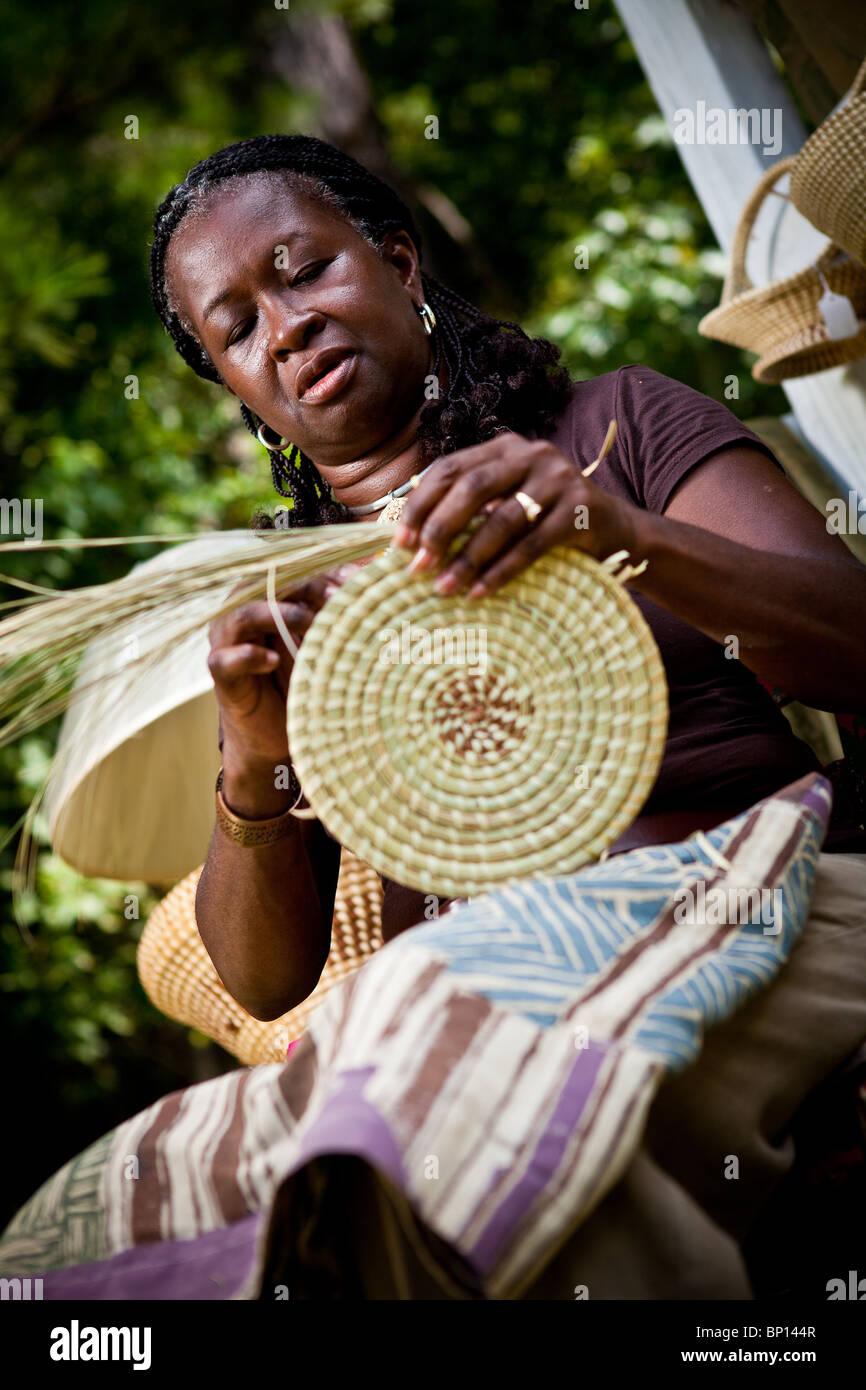Barbara Manigault, a Gullah sweet grass basket weaver at her stand in
