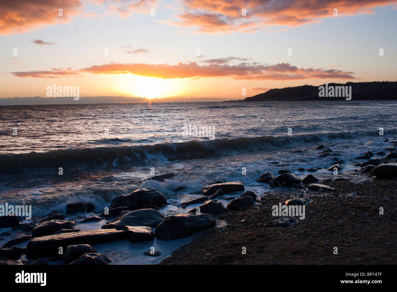 Sunset on Charmouth beach Dorset England UK Stock Photo