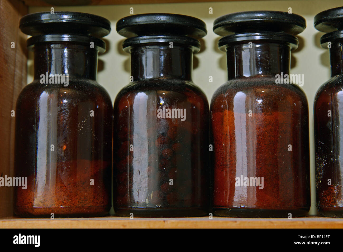 Laboratory bottles on shelf Stock Photo