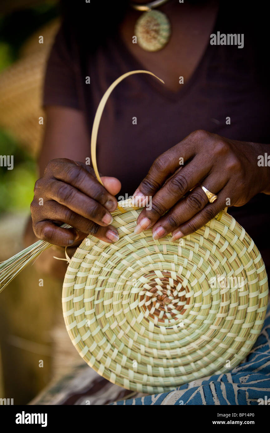 Barbara Manigault, a Gullah sweet grass basket weaver at her stand in