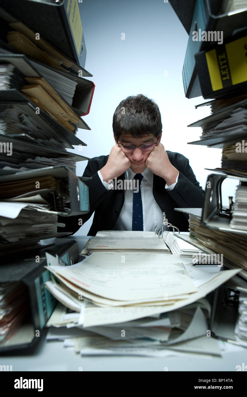Desperate bookkeeper at work Stock Photo - Alamy