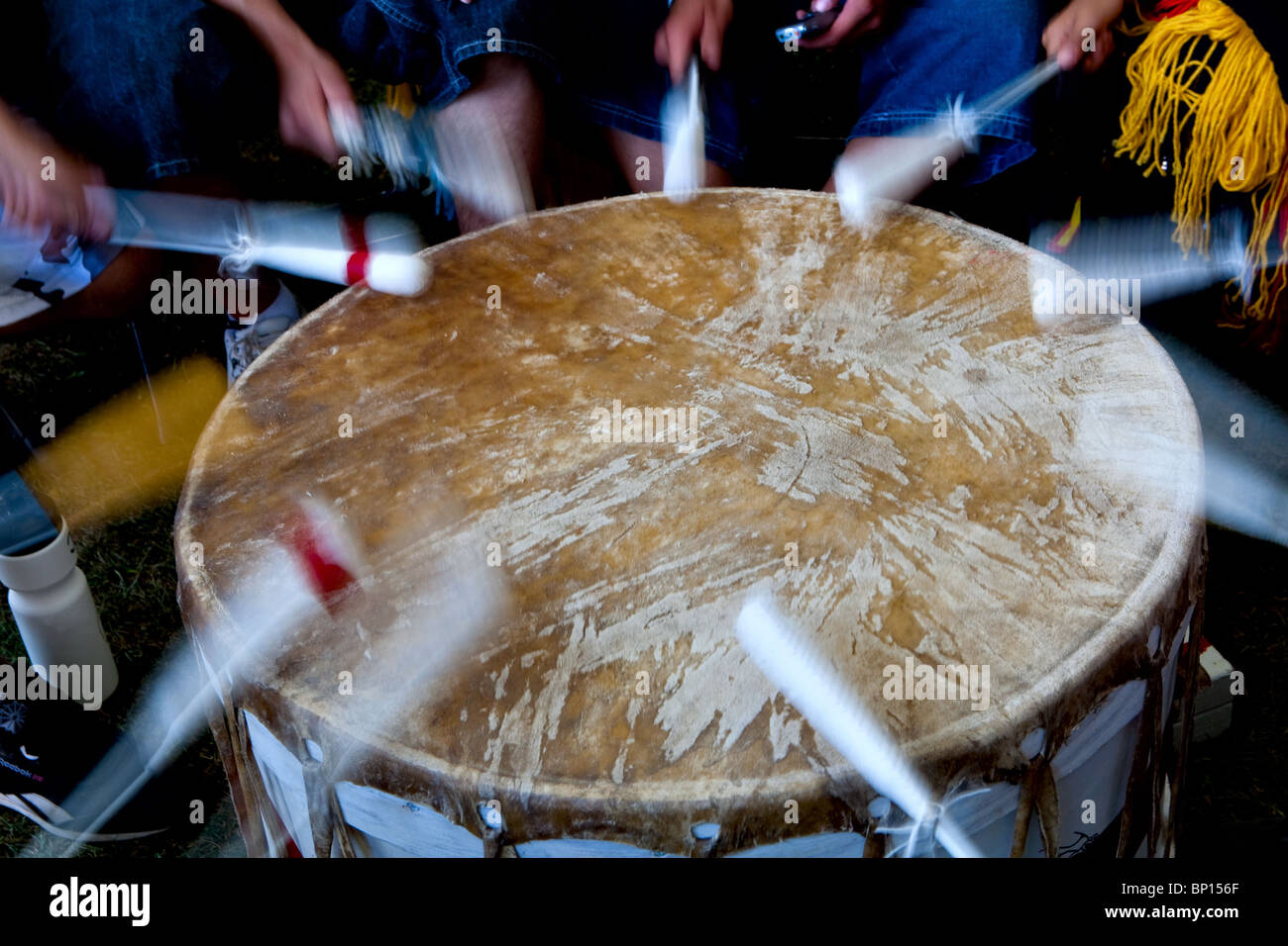 Drummers hits a drum during the traditional dance contest of the Wendake Pow-Wow Stock Photo