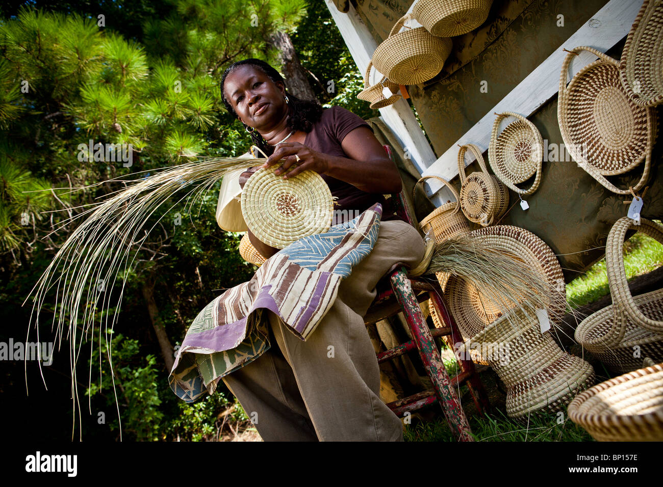 Barbara Manigault, a Gullah sweet grass basket weaver at her stand in