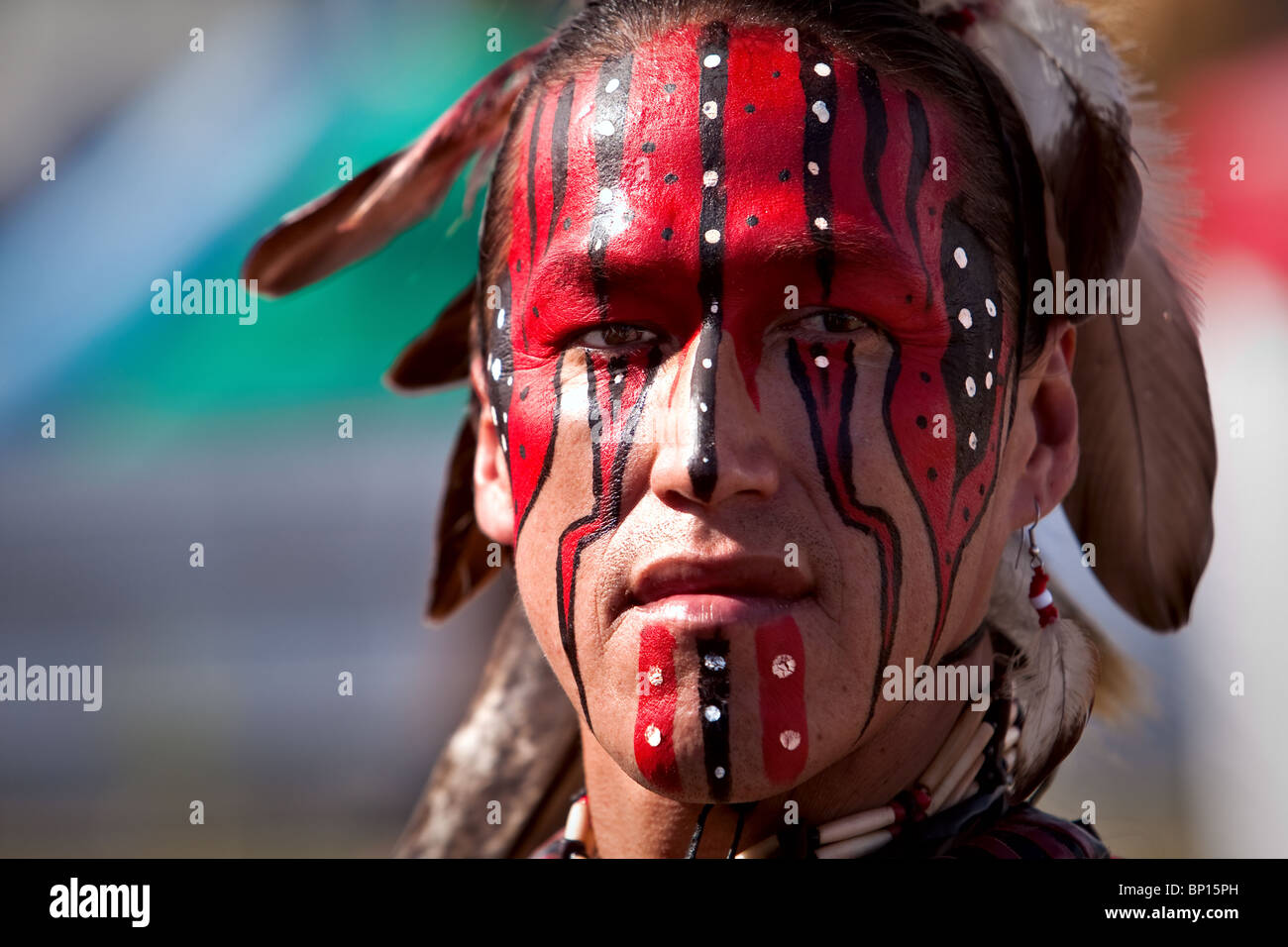 a native of Lac-Simon indian Reservation and wearing Algonquin traditional dresses and paint Stock Photo