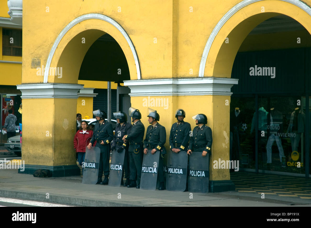 Police officers with riot shields opposite the Presidential Palace in Plaza de Armas, Mayor, Lima, Peru. Stock Photo