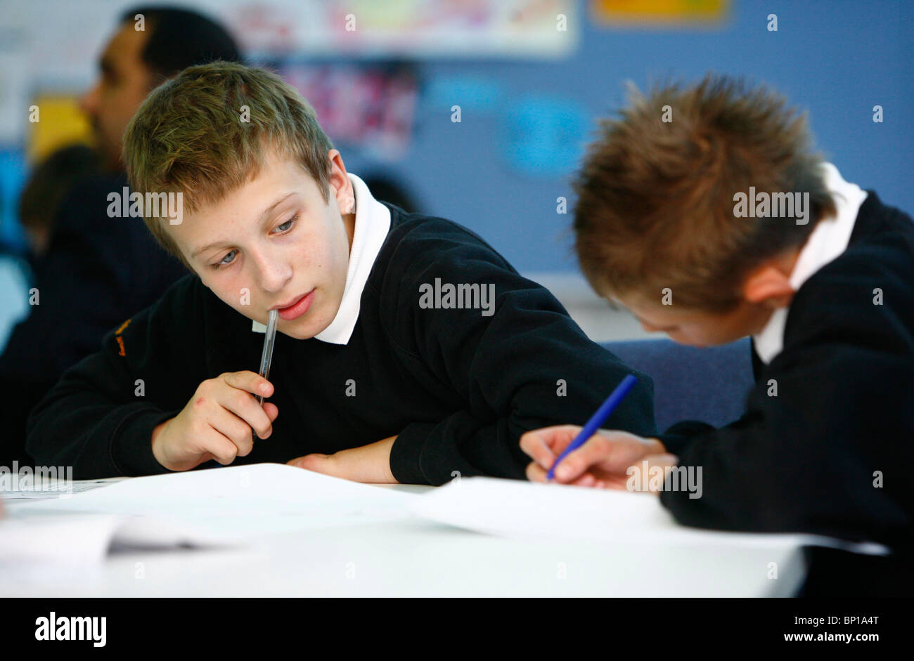 Young students working in Class. Picture by James Boardman. Stock Photo