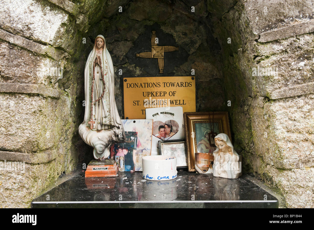 Holy relics and gifts left at St Brigid of Kildare's shrine. Stock Photo