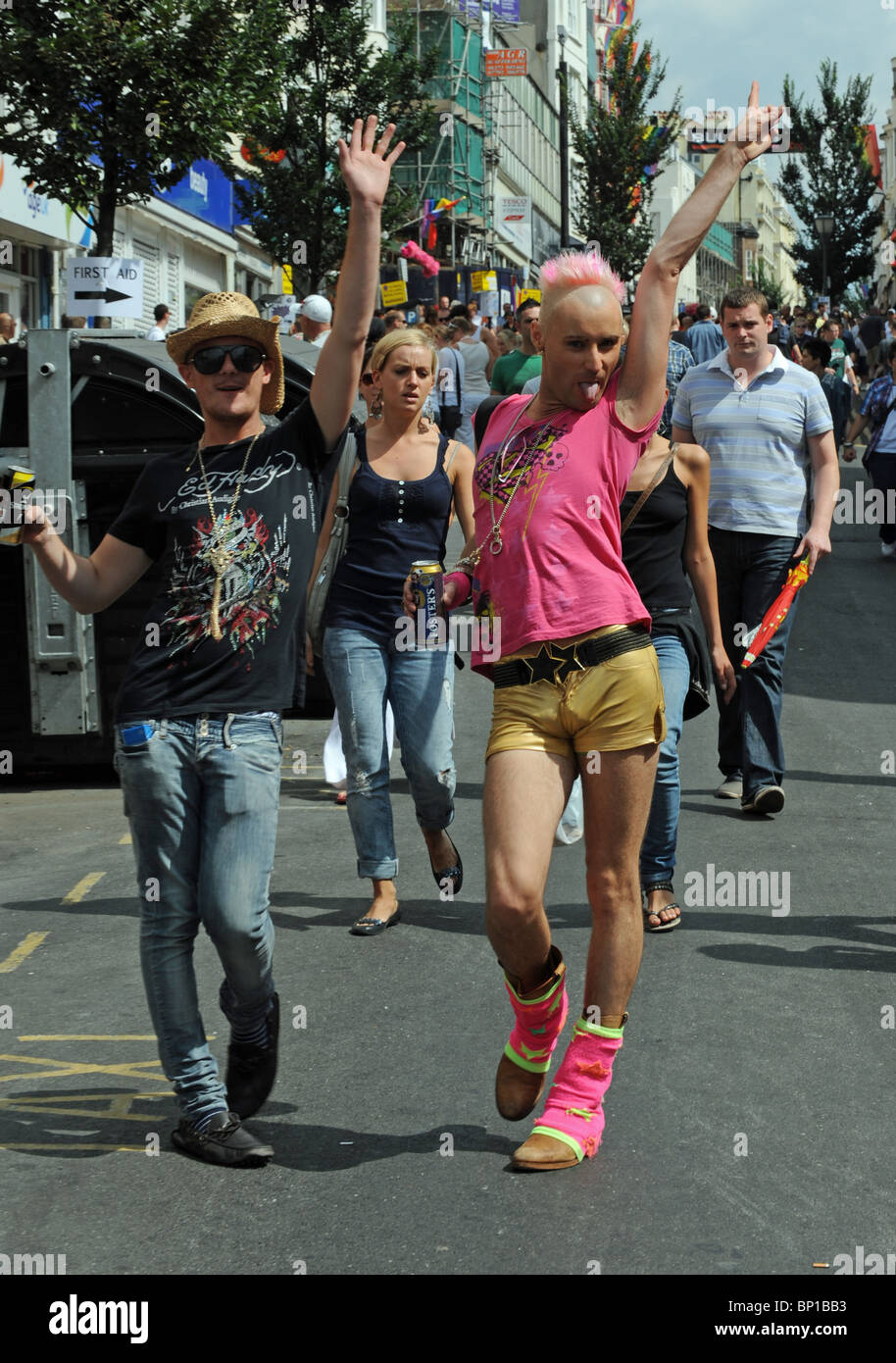 Male couple having fun at Pride  event in Brighton UK Stock Photo