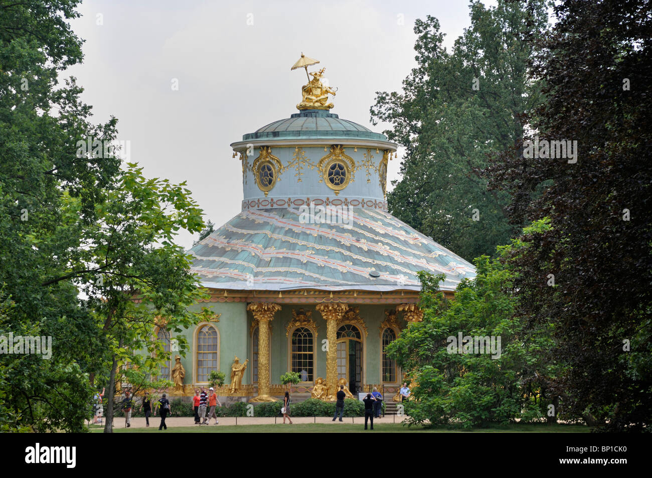 Visitors walk past the Chinese Teahouse at the Park Sanssouci in Potsdam, eastern Germany July 2010 Stock Photo