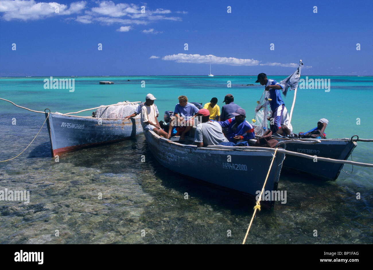 Group of fishermen at Bain Boeuf beach. Cape Malheureux, Mauritius Island, Indian Ocean Stock Photo