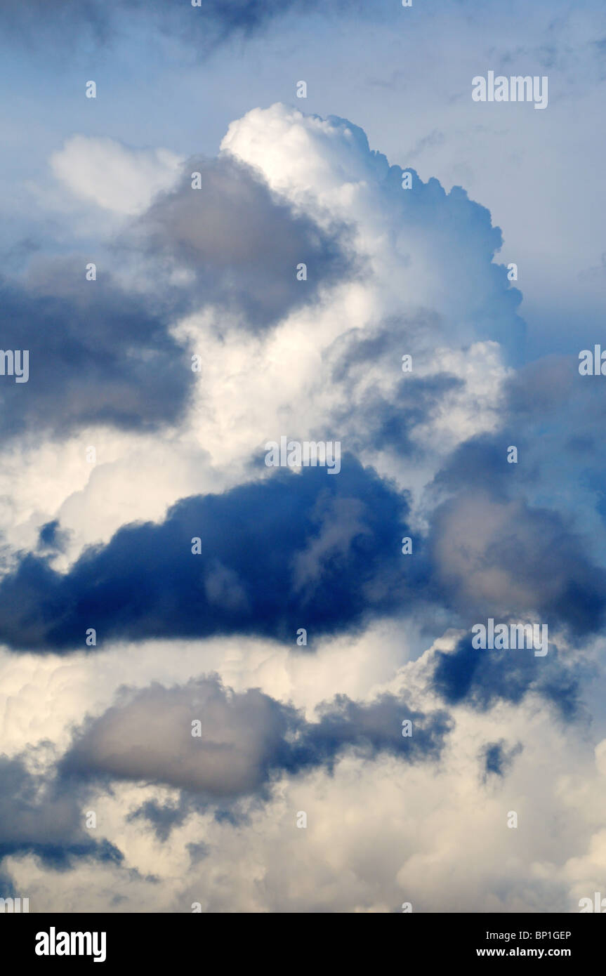 Storm clouds forming against dark background Stock Photo