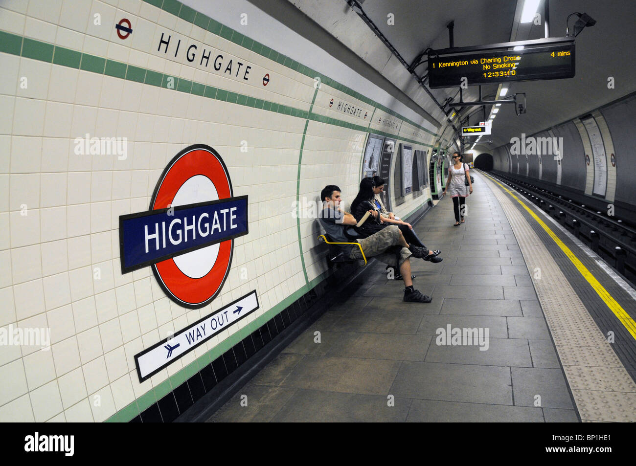 LONDON UNDERGROUND PASSENGERS AT PLATFORM OF HIGHGATE STATION IN THE