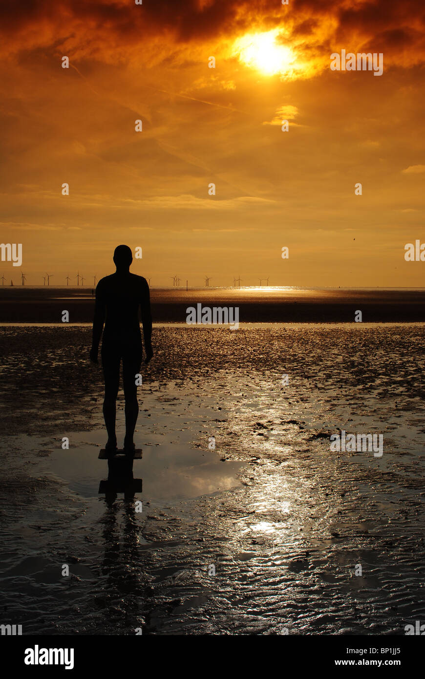 Statue at Sunset Crosby Beach Liverpool Stock Photo Alamy