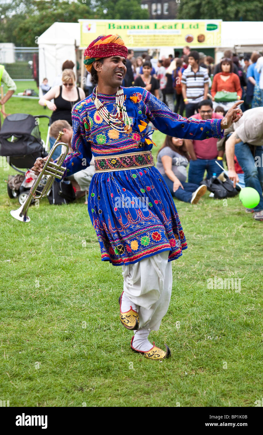 Trumpeter from the Jaipur Kawa Brass Band dancing during an outdoor