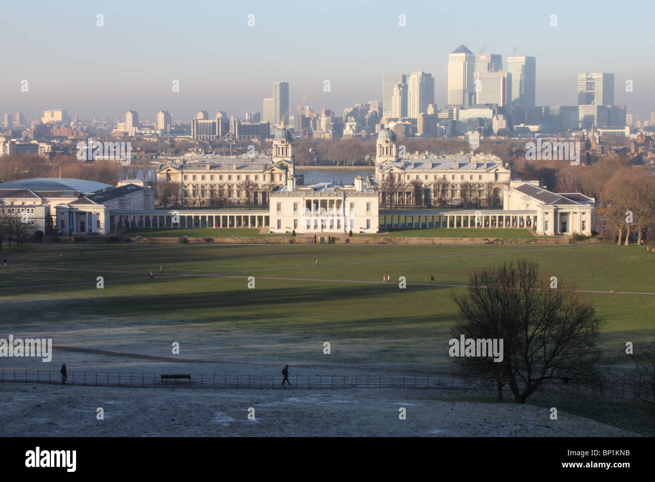 View across Greenwich Park to The Queens House and Royal Naval College, with River Thames and Canary Wharf in background, London Stock Photo