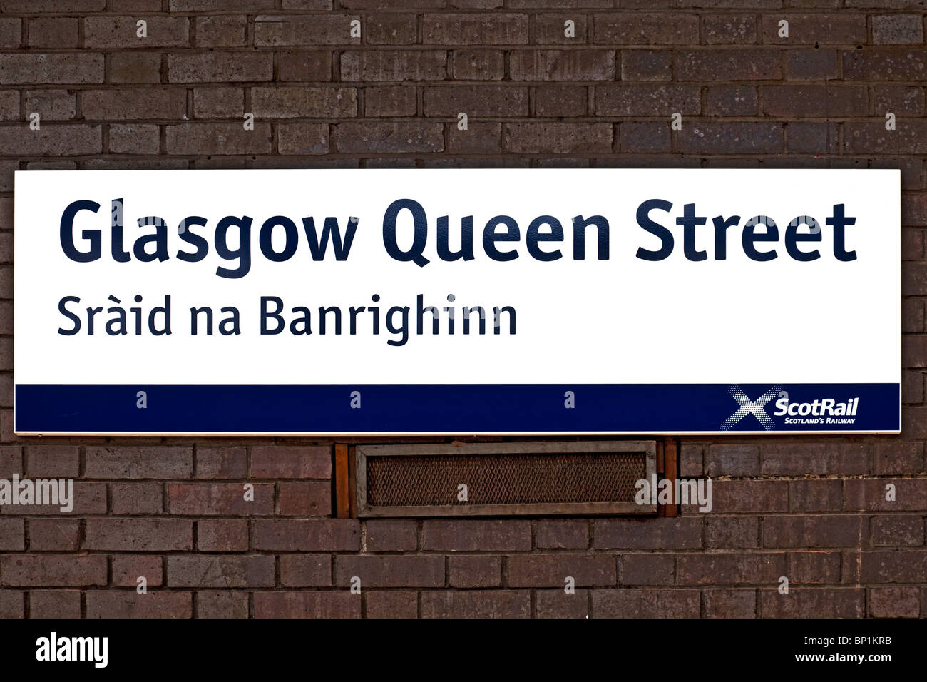A bilingual sign (English and Scottish Gaelic) for Queen Street Station in Glasgow, Scotland, UK, Great Britain. Stock Photo