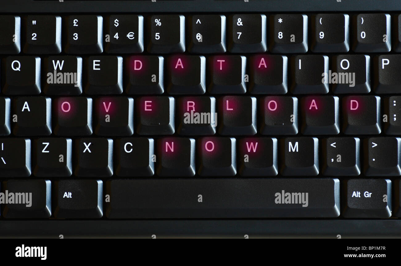 Digitally altered QWERTY keyboard with the legend DATA OVERLOAD NOW showing in red. Stock Photo