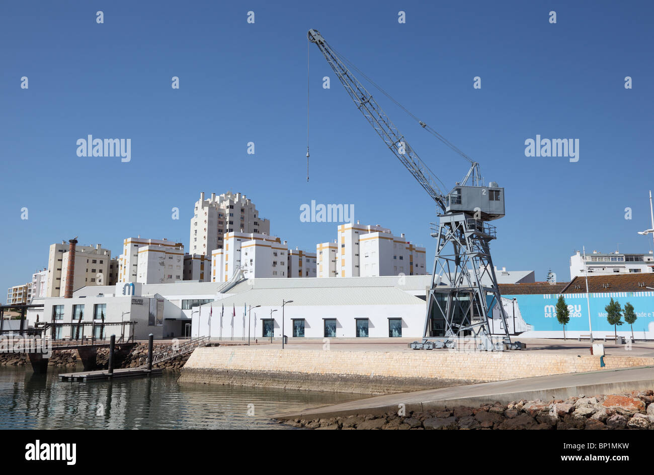 Crane in the old docks of Portimao, Portugal. Stock Photo