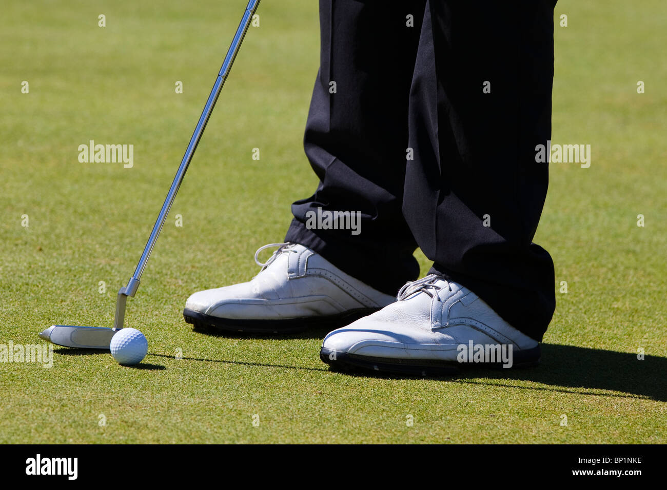 Golfer set up to make a putt, Kilmarnock Barassie Golf Club, Troon, Ayrshire, Scotland Stock Photo