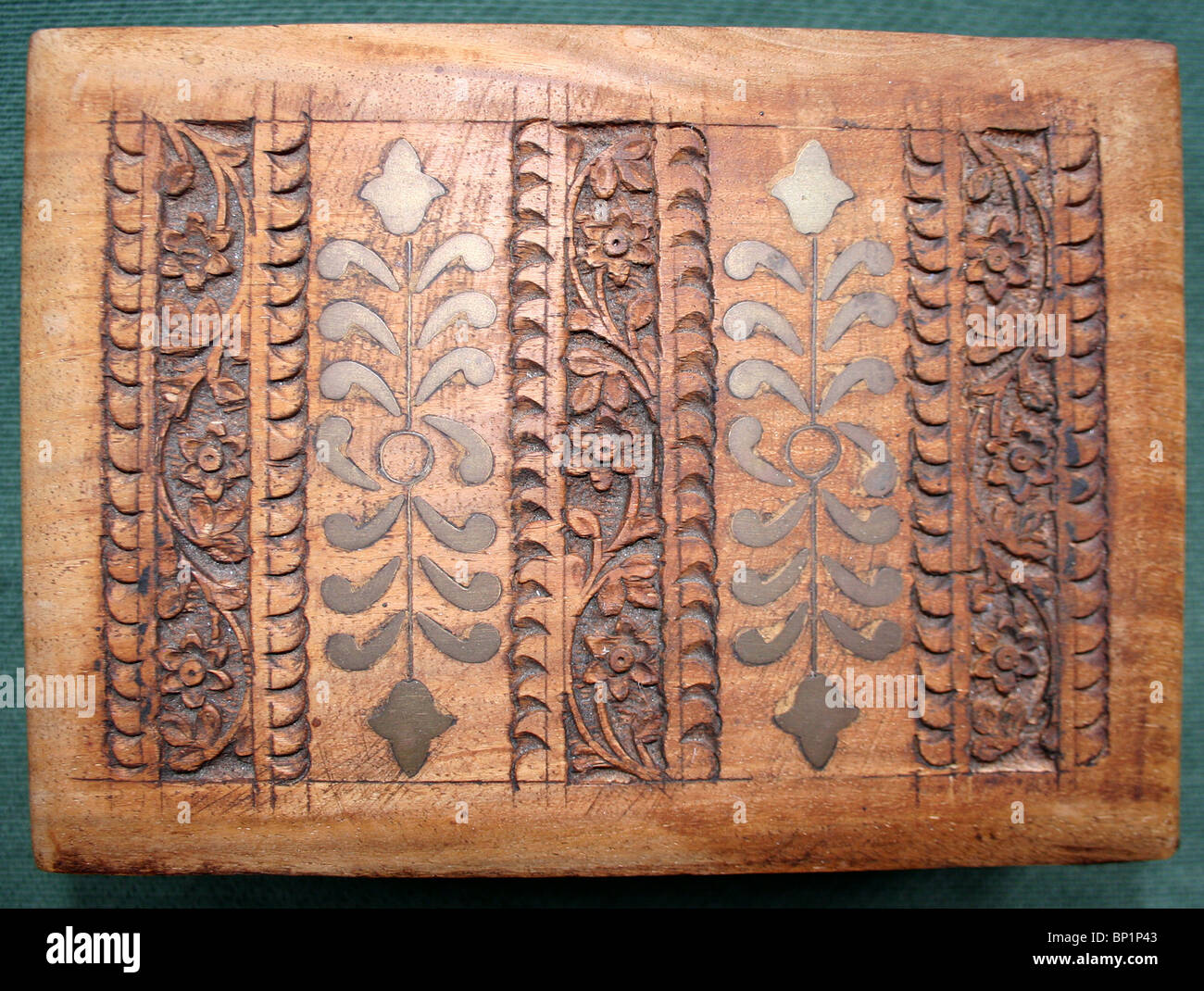 A wooden carved Indian box with brass inlays Stock Photo Alamy