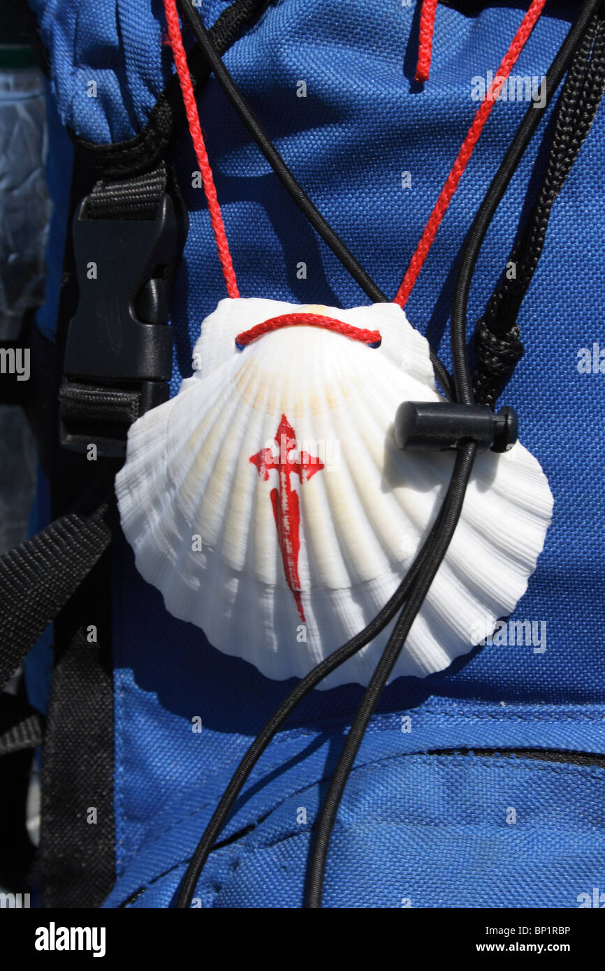 Scallop shell painted with a cross on the back of a pilgrim's rucksack ...