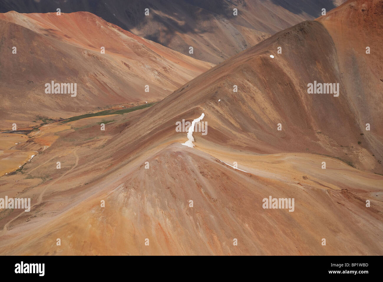 Red Mountains High in Andes Range, near Santiago, Chile, South America - aerial Stock Photo