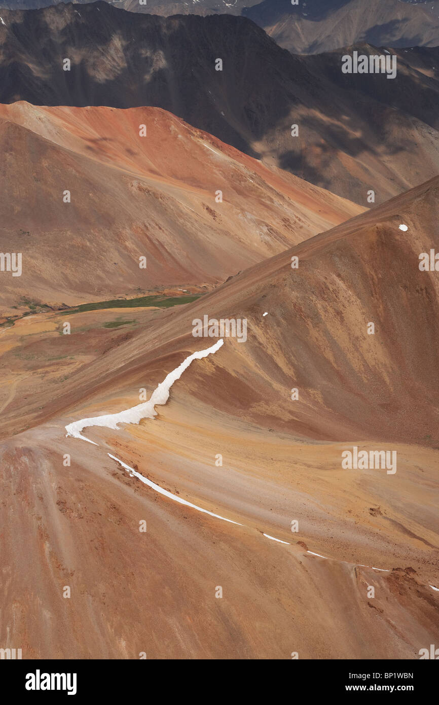 Red Mountains High in Andes Range, near Santiago, Chile, South America - aerial Stock Photo