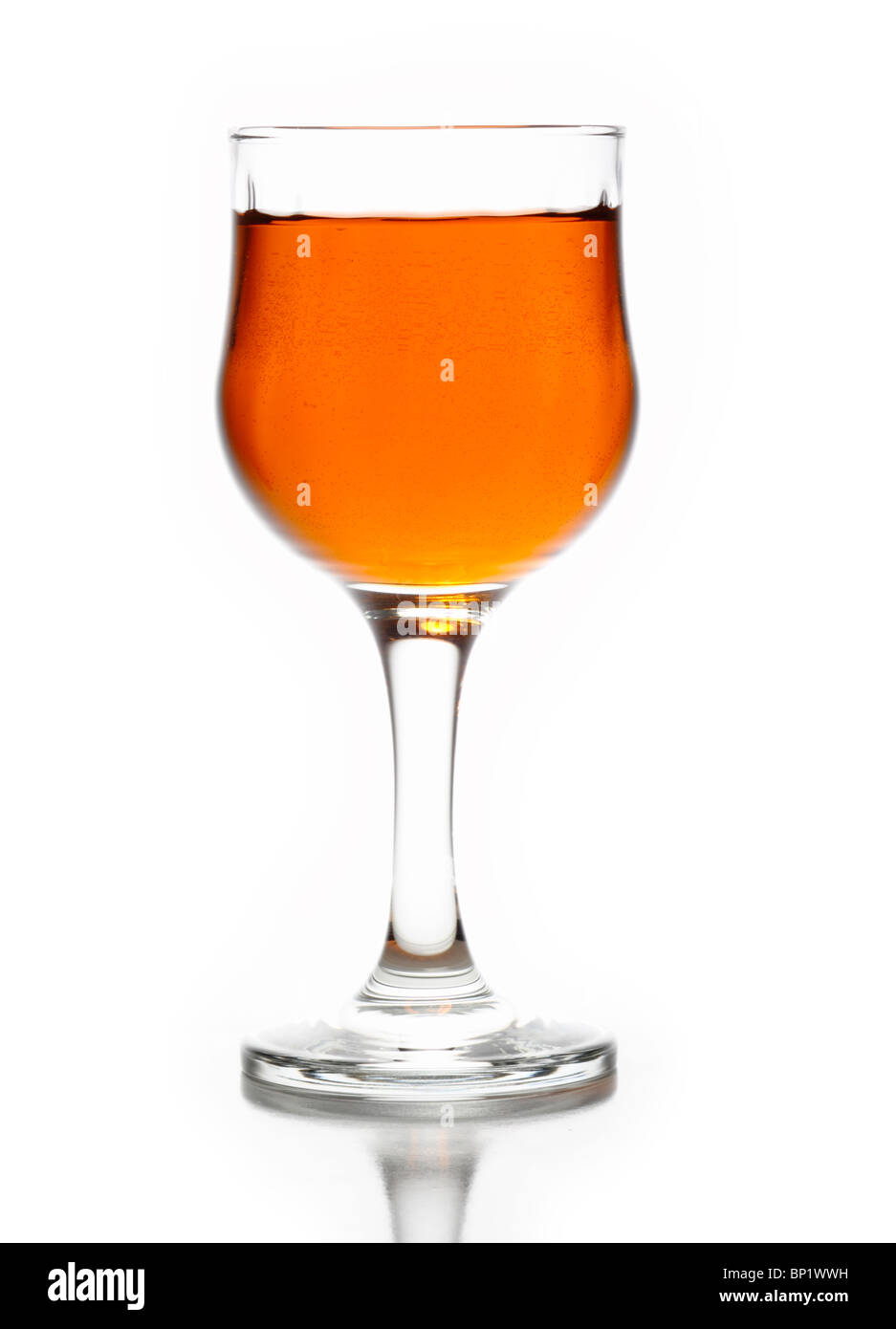 Whiskey in glass chalice on white Stock Photo
