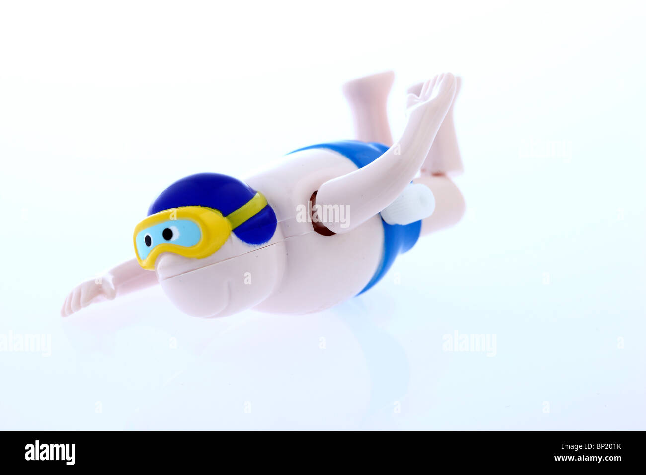 Mechanische Spielzeugfigur, aufziehbar, bewegt Arme und Beine, kann schwimmen. Stock Photo