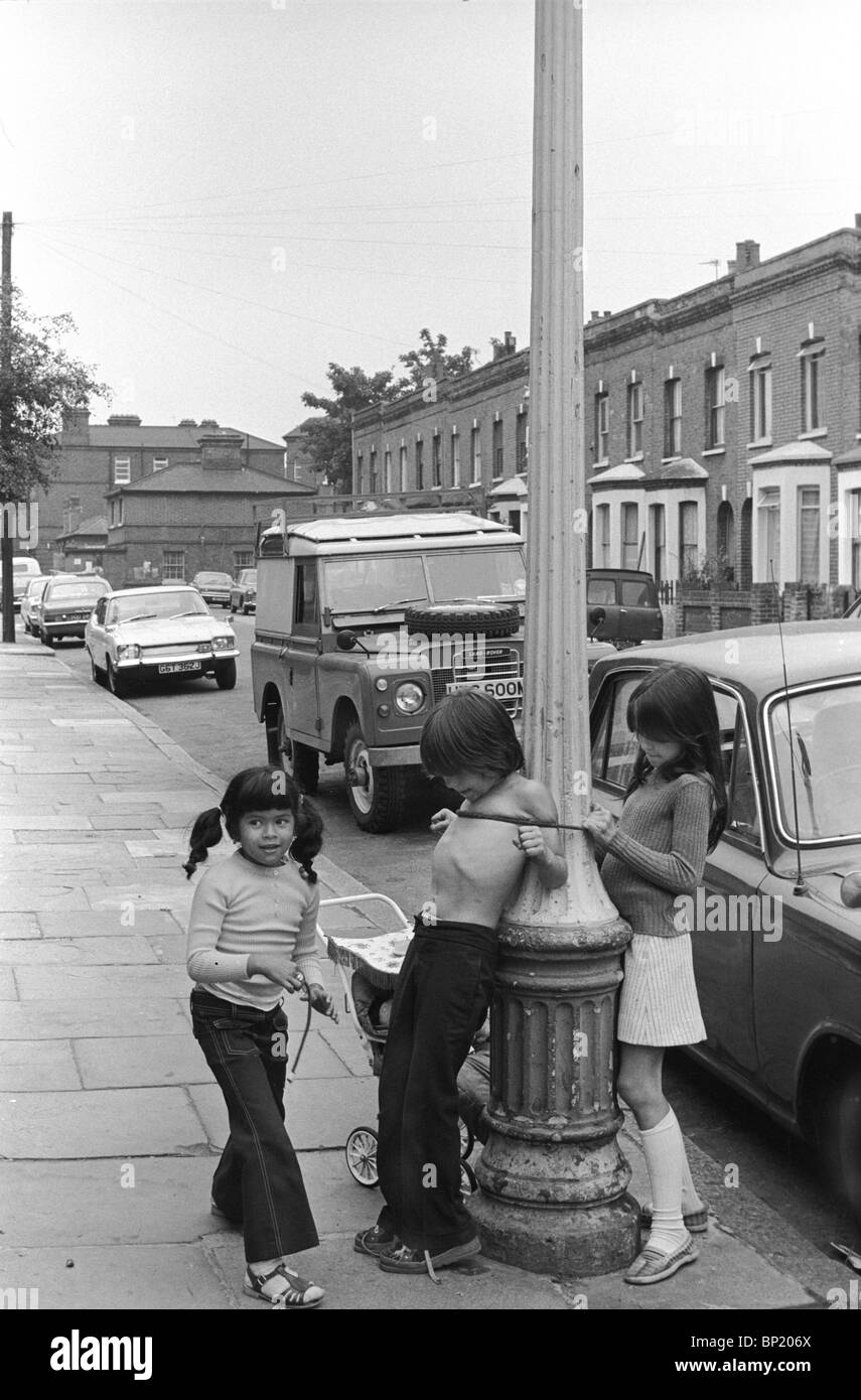 Children playing in the street 1975.  Ethnicity diversity working class Elephant and Castle South London 1970s UK HOMER SYKES Stock Photo
