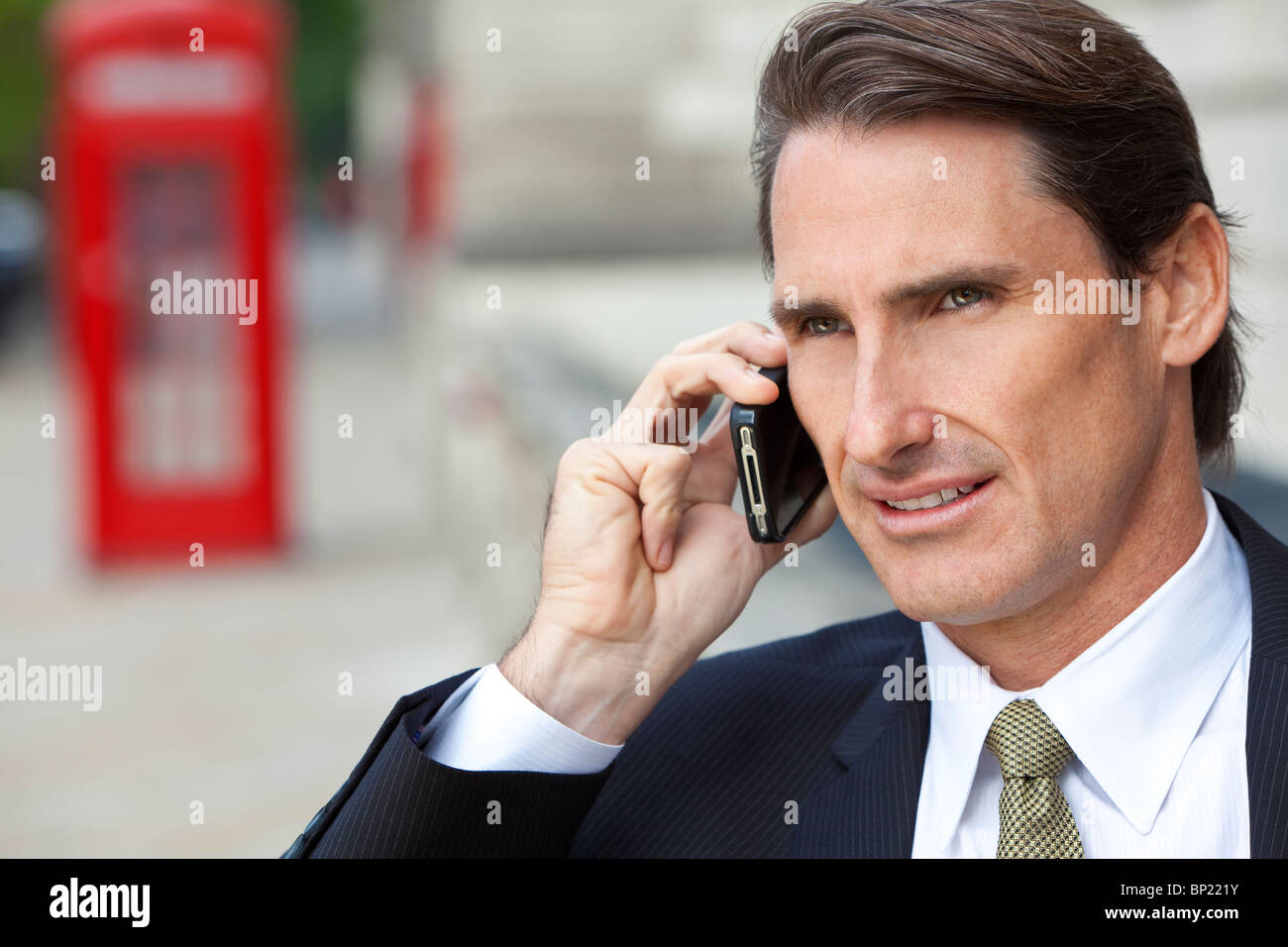 A successful businessman talking on his cell phone in London, England
