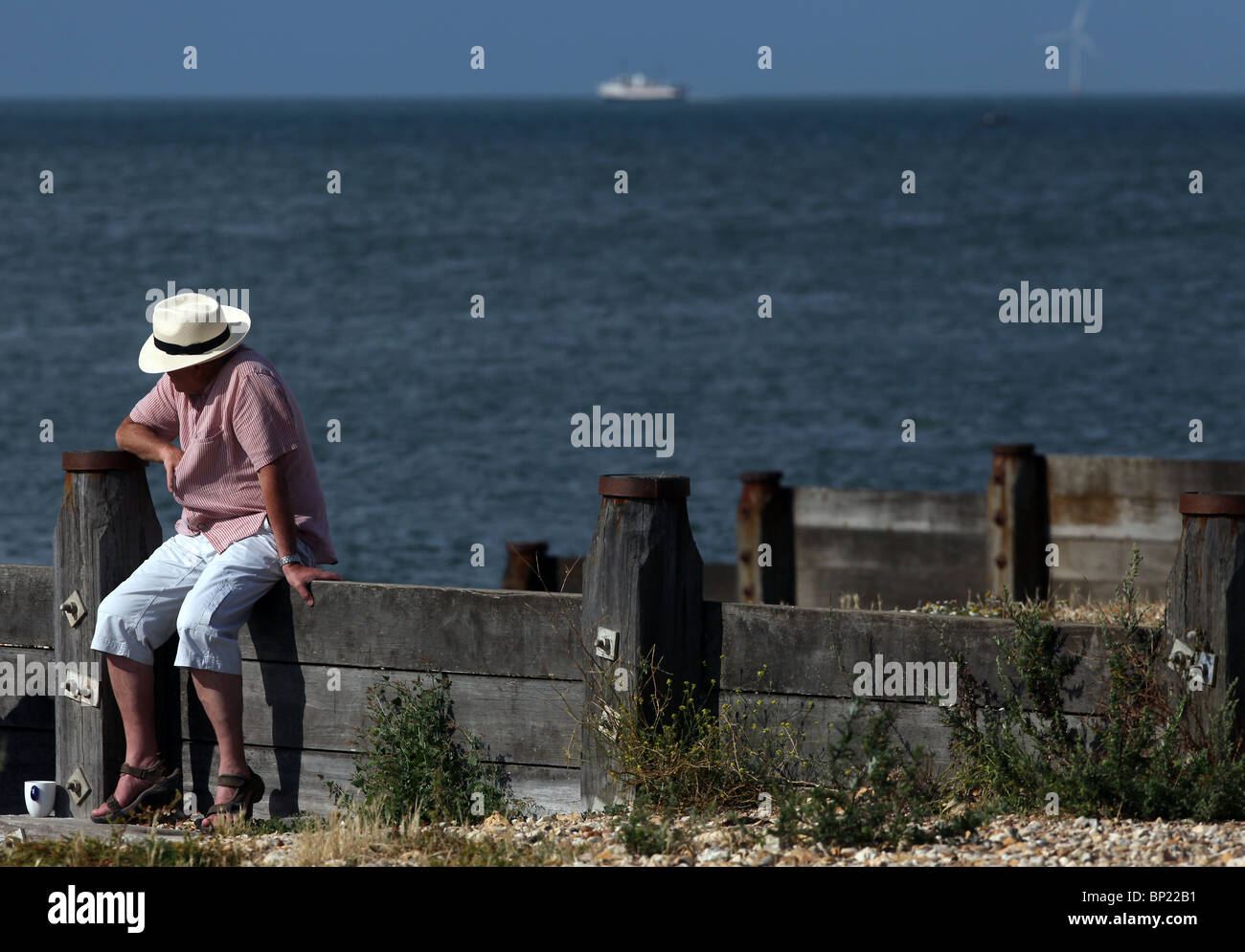 Visitors enjoy the warm weather on the beach in Whitstable, Kent Stock Photo