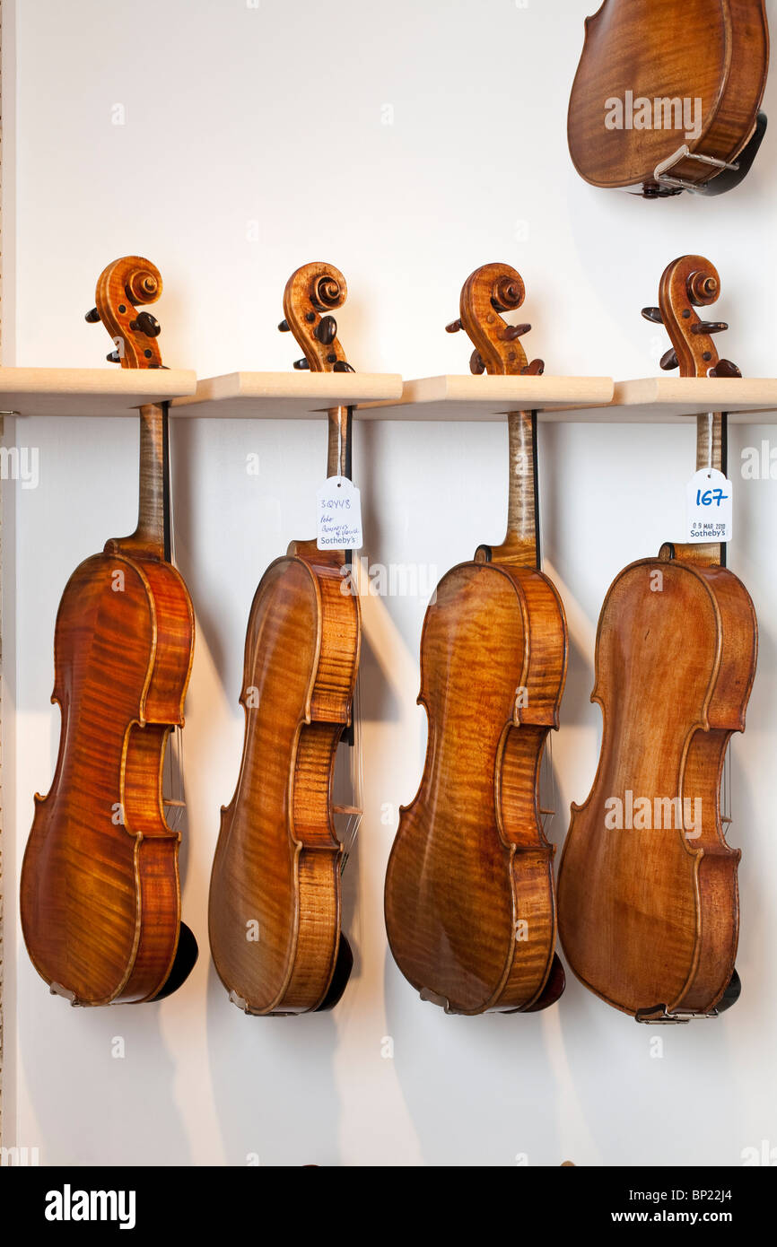 Classical Violins wait to be auctioned at Sotheby's in Bond Street, London, UK. Photo:Jeff Gilbert Stock Photo