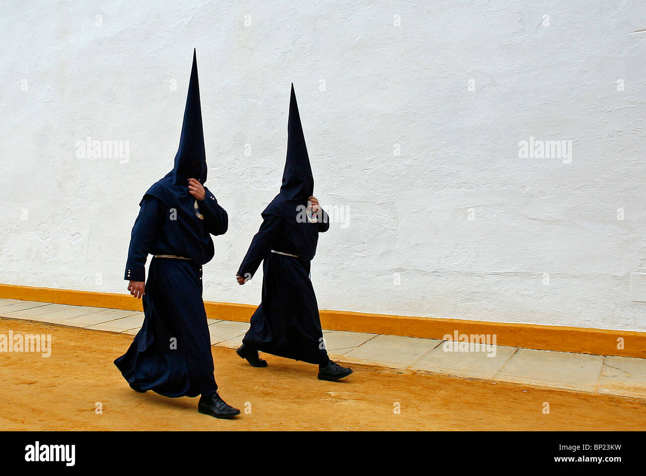 Hooded members of a Brotherhood walk during the Semana Santa processions in Seville, southern Spain on April 4, 2007. Stock Photo