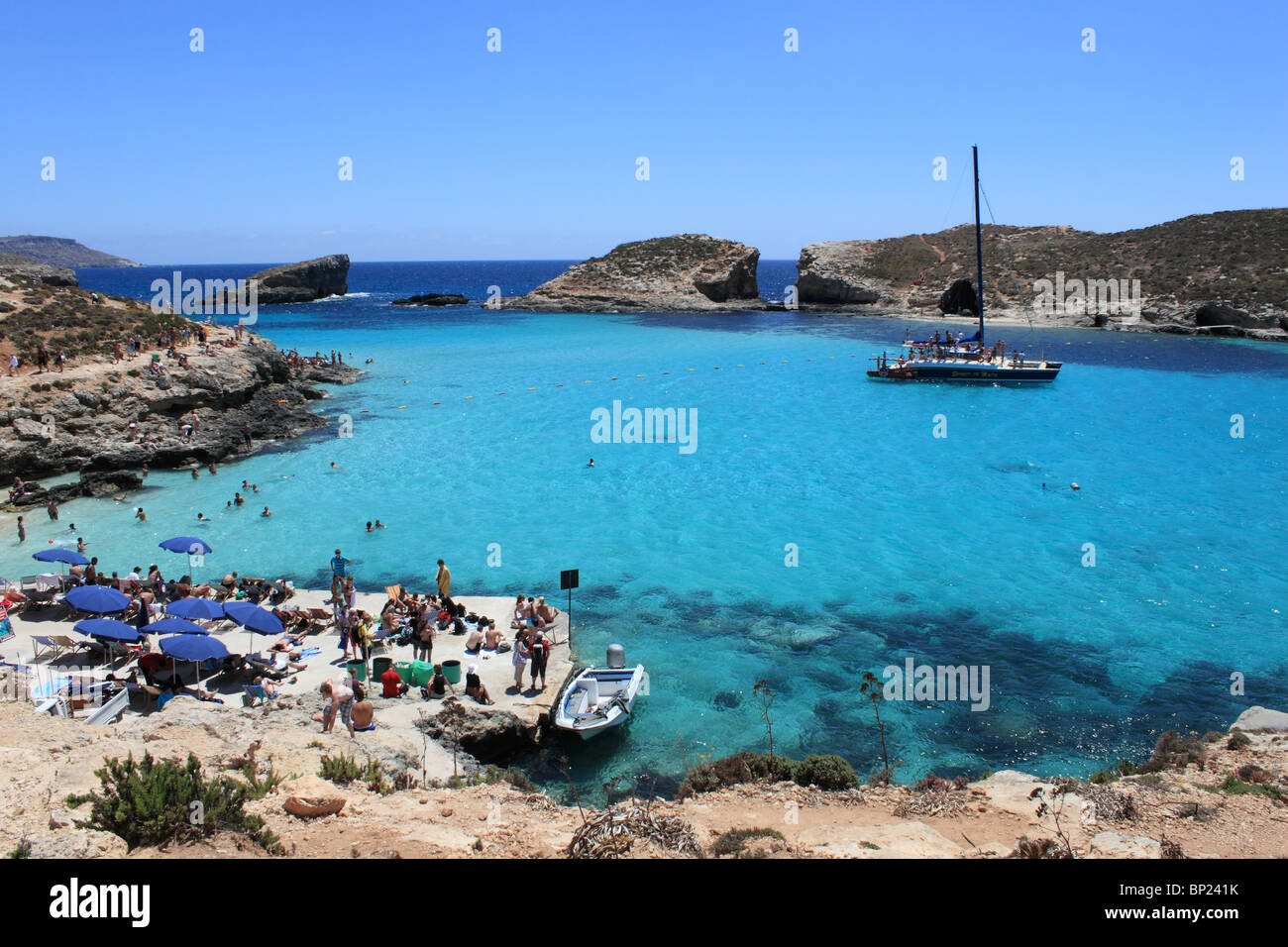 Bathing in the azure waters of the Blue Lagoon with Cominotto beyond