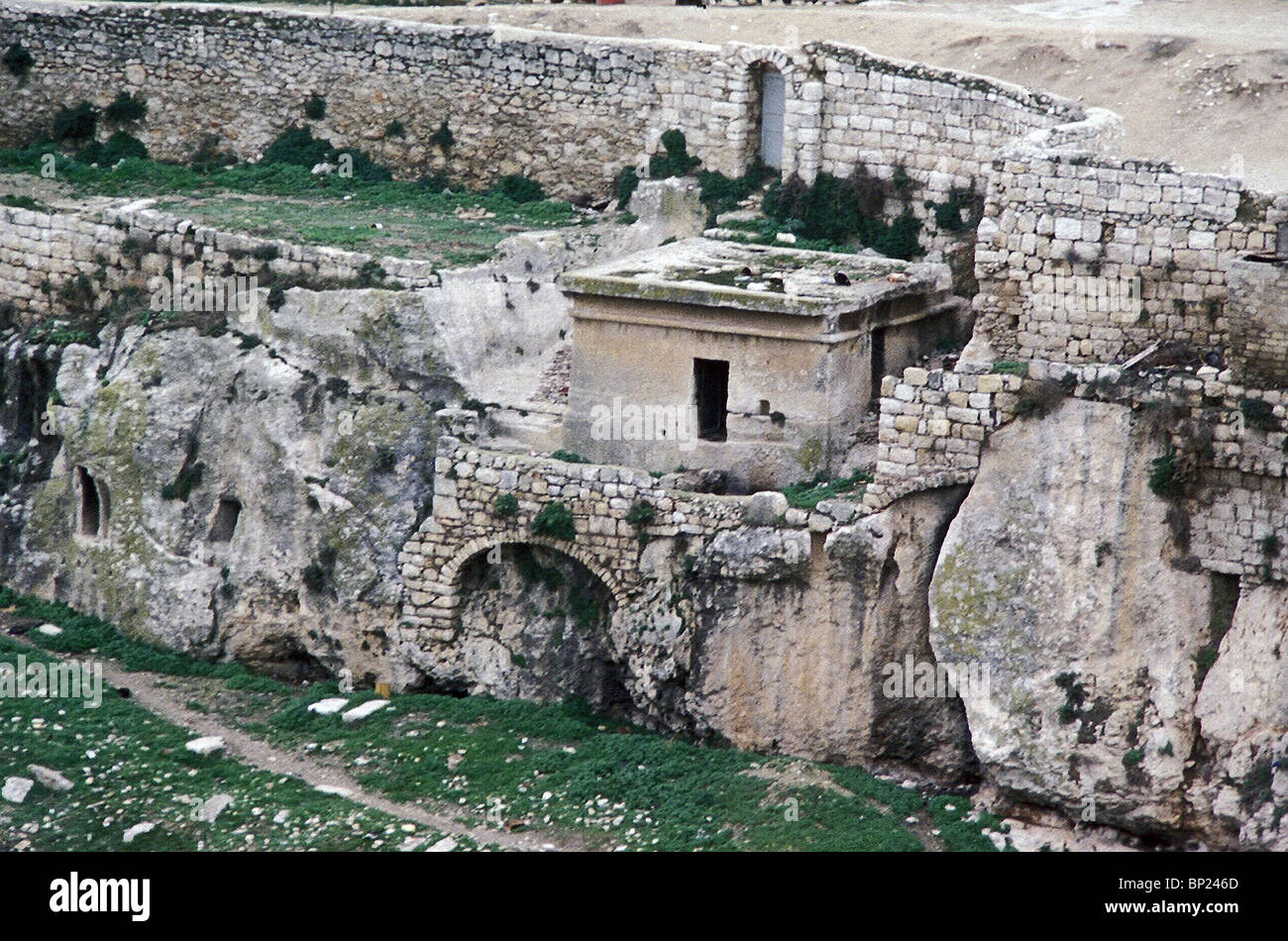 416. THE REMAINS OF THE TOMB TRADITIONALLY CALLED THE 'TOMB OF PHARAOH'S DAUGHTER', IS CARVED OF A ROCK IN THE KIDRON VALLEY, DA Stock Photo