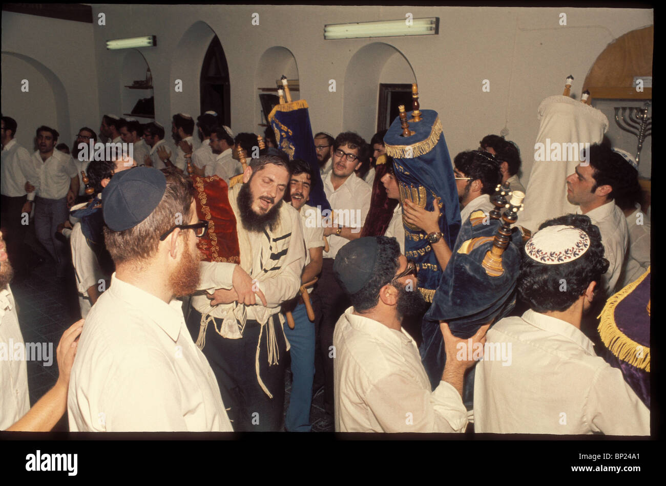 SIMCHAT TORAH - THE LAST DAY OF SUCCOT ON WHICH THE COMPLETION OF READING THE ANNUAL CYCLE OF THE TORAH IS CELEBRATED BY Stock Photo
