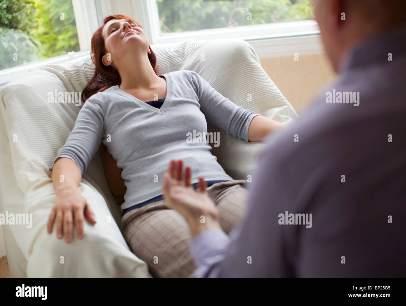 Woman sitting comfortably eyes hi-res stock photography and images - Alamy