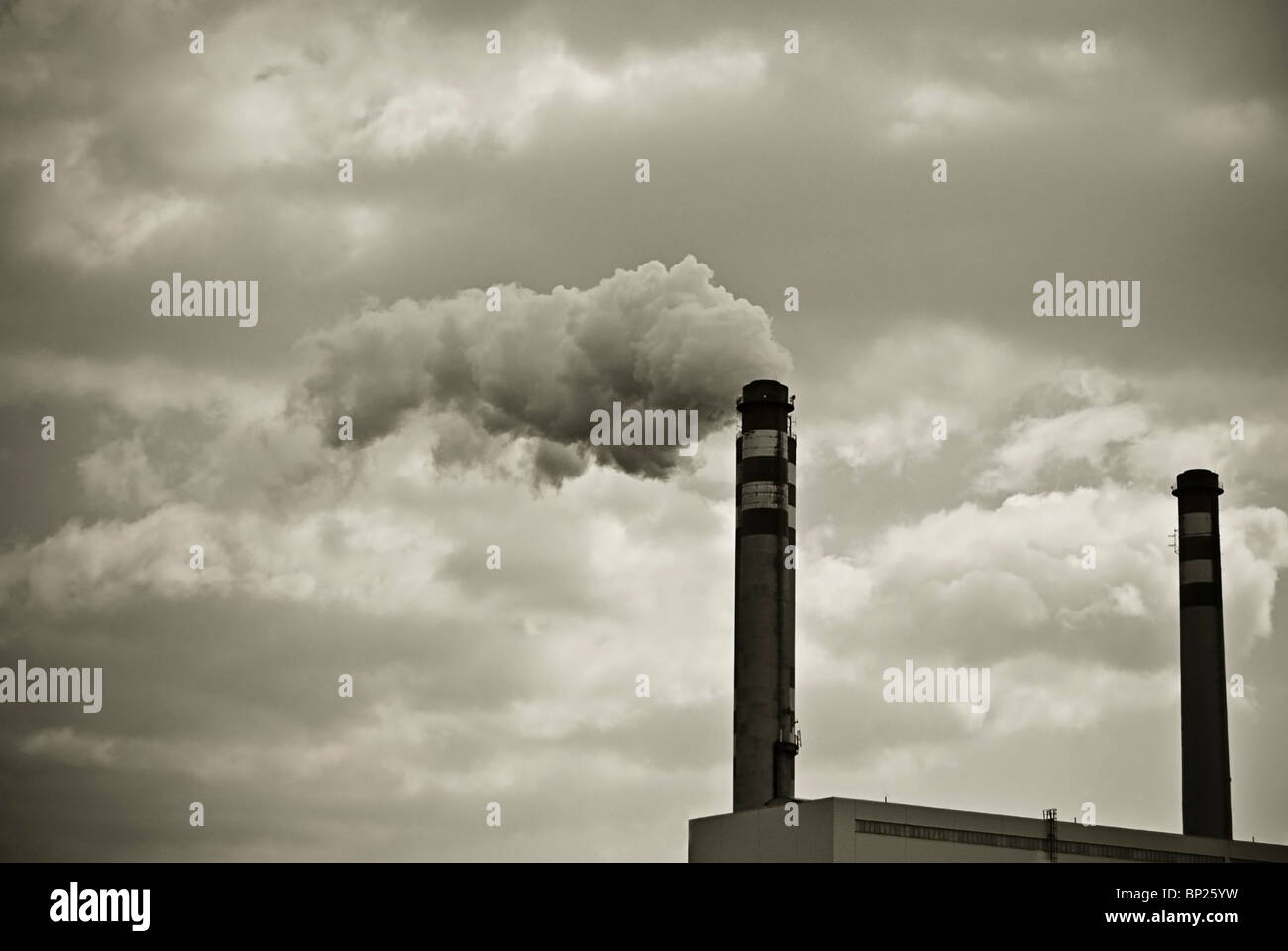 chimneys with smoke from a coal power plant Stock Photo